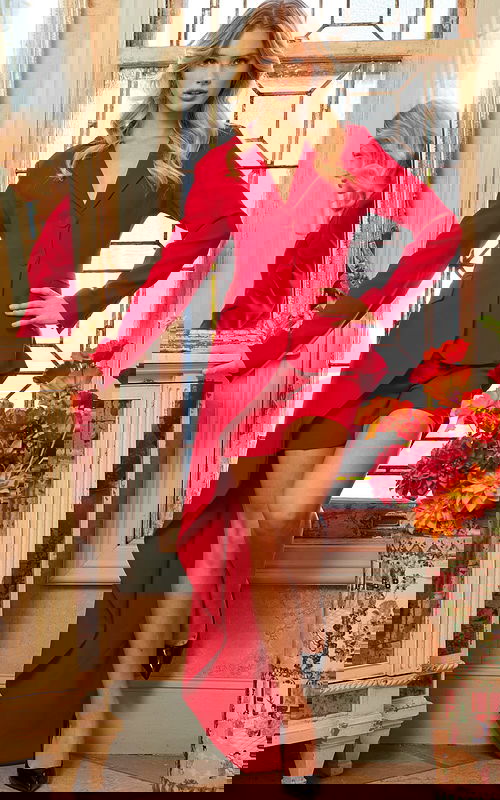 Model wearing Jovani 06876 red high-low blazer dress with train, front view.