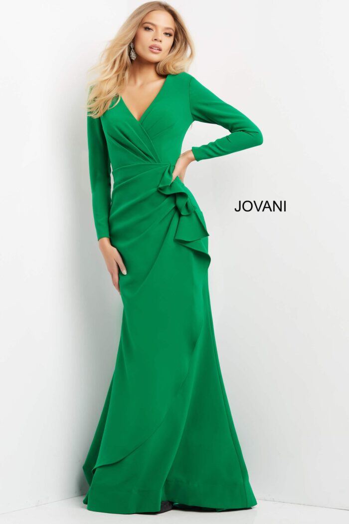 Model showing Jovani 06995 emerald green gown with refined A-line silhouette.