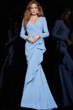 model wearing Jovani 06995 in blue front view showcasing the ruffle detail