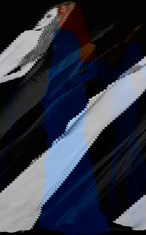 model wearing Jovani 06995 in blue back view showcasing the fitted silhouette