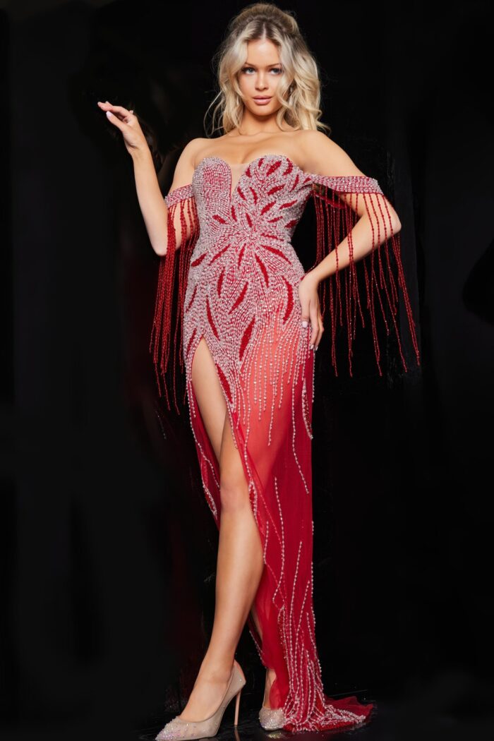 Model wearing Jovani 07031 red gown with beadwork and tassel sleeves