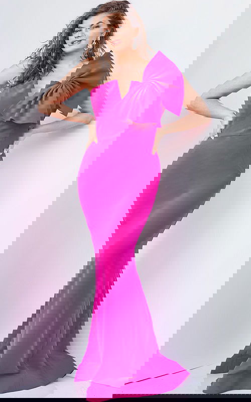 Model wearing Jovani 07306 vibrant fuchsia gown with asymmetric neckline and bow from front view