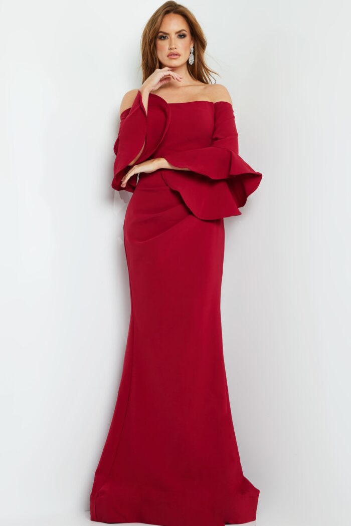 Model in Jovani 07065 cranberry gown, showcasing the off-the-shoulder neckline and elegant body-hugging fit.