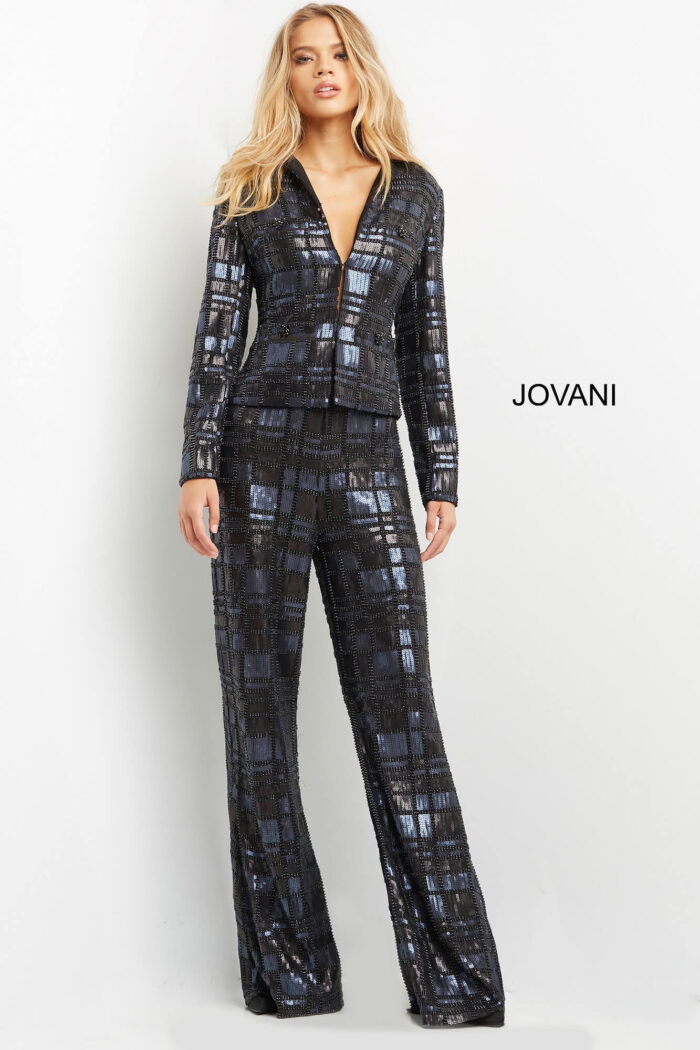 Model wearing Jovani 07166 navy suit with fitted bodice and long sleeves, front view