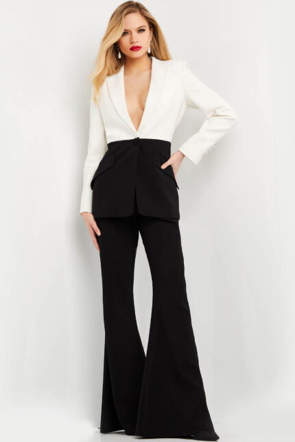 Model wearing Jovani 07205 ivory blazer with black trousers, front view