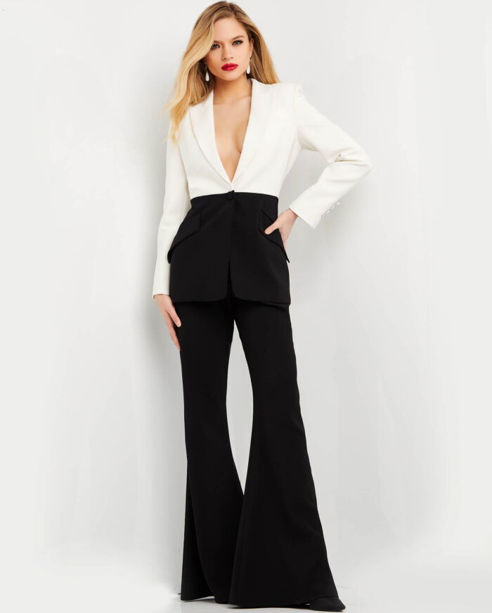 Model wearing Jovani 07205 ivory blazer with black trousers, front view
