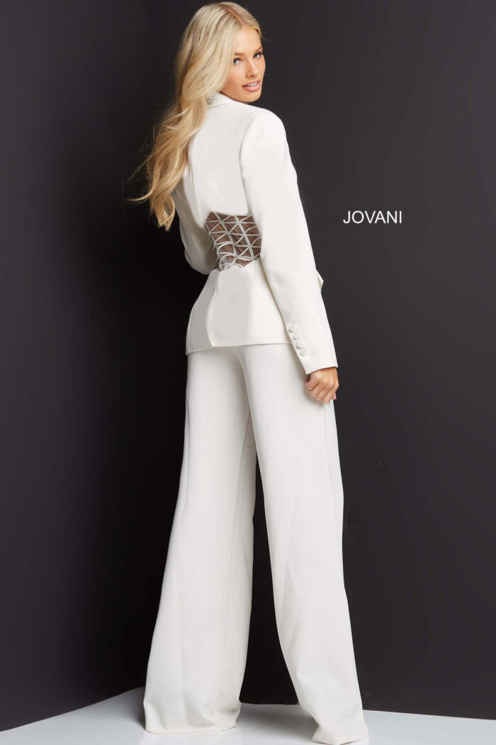 Back view of model wearing Jovani 07227 ivory pantsuit showing sheer netted waist detail.