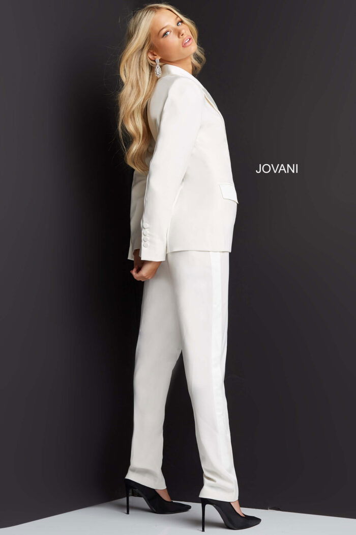 Model wearing Jovani 07293 ivory jumpsuit, back view.