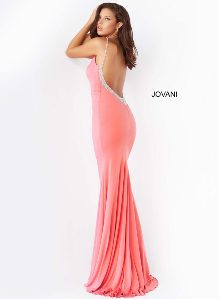 Model wearing Jovani 07297 in hot pink, side view.