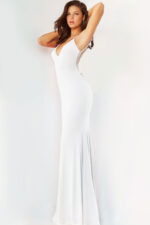 Model wearing Jovani 07297 in white, side view.