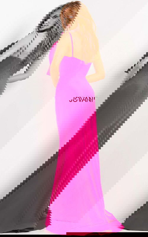 Model wearing Jovani 07306, fuchsia dress, back view with low cut and straps.