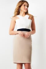 Model wearing Jovani 07413 Ivory and Taupe knee-length dress, front view.