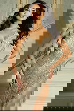 Close-up of crystal beadwork and illusion detailing on bodice