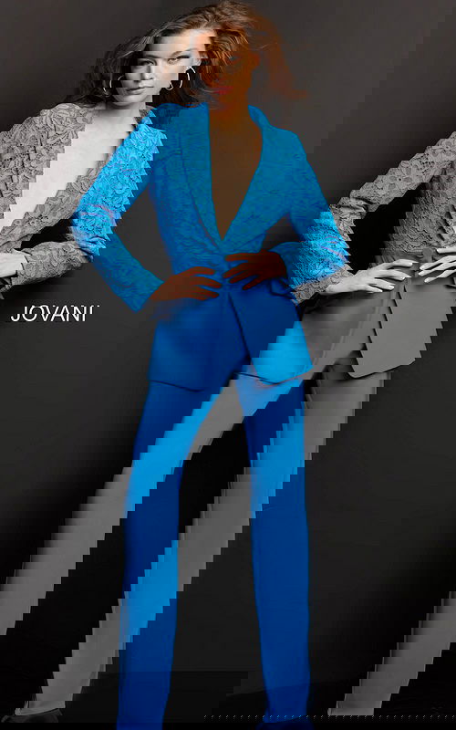 Model wearing Jovani 07551 blue lace blazer with trousers, front view