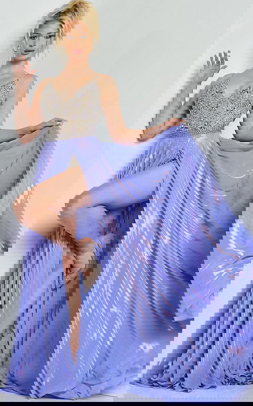 Model wearing Jovani 07659 silver gown with plunging neckline and high slit