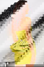 Back view of model in Jovani 07807 lime dress with bow embellishment