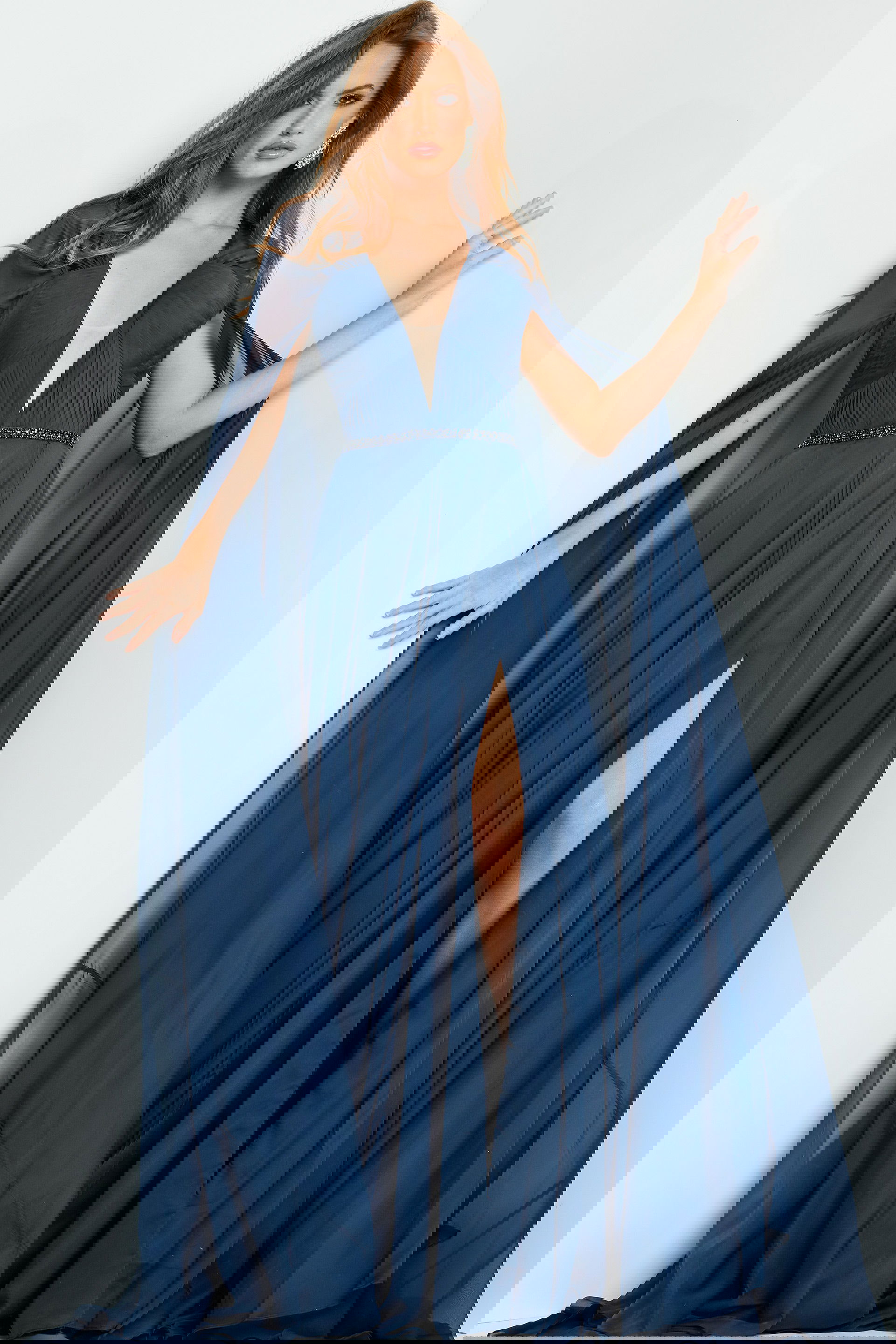 07928-NAVY-207.jpg model wearing Jovani 07928 navy gown with high slit and deep V-neckline