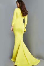 Back view of model in Jovani 07934 yellow gown showing mermaid silhouette