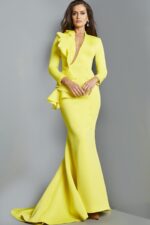 Model wearing Jovani 07934 yellow gown with ruffle detail, front view