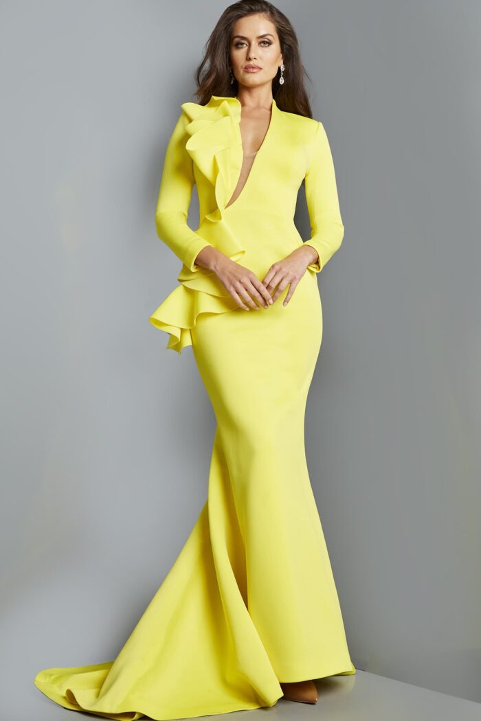 Model wearing Jovani 07934 yellow gown with ruffle detail, front view