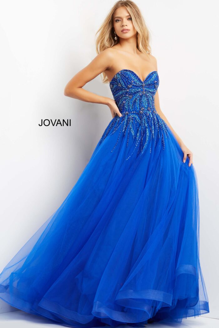 Model wearing Jovani 07946 royal blue ball gown with embellished bodice