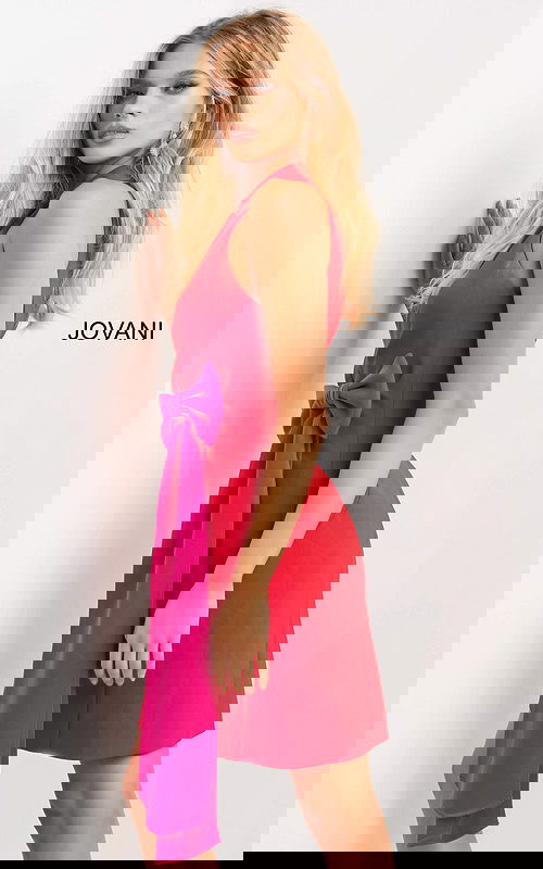 model wearing Jovani 07961 red dress with fuchsia bow detail, angled view