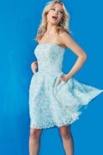 Model wearing 07965 cocktail dress, mid-swirl, in a multi-colored floral pattern.