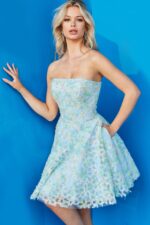 Model wearing 07965 cocktail dress, side view, in a multi-colored floral pattern.
