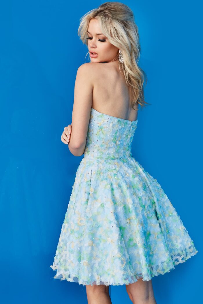 Model wearing 07965 cocktail dress, detailed back view, in a multi-colored floral pattern.