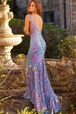 Model displaying the low scoop back of Jovani 08099 mermaid gown, rear view.