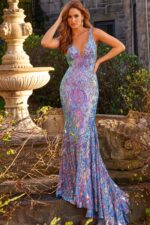 Front pose of model in Jovani 08099 mermaid gown with intricate multi-colored design.