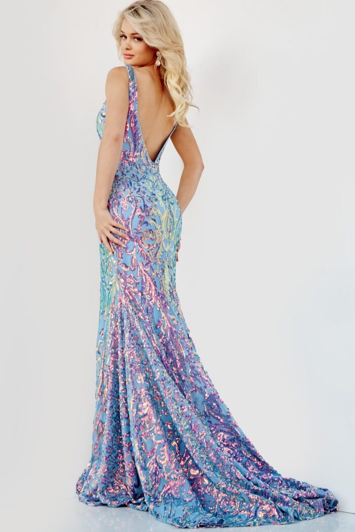 Model turns to showcase the Jovani 08099 dress's low back details.