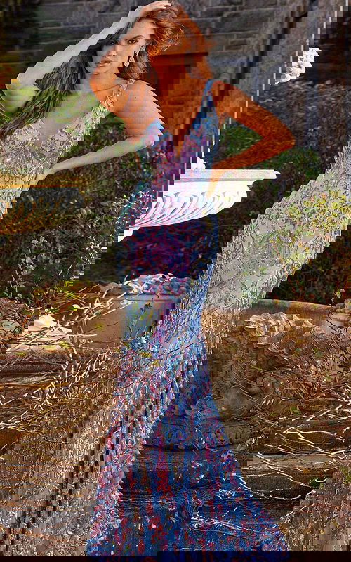 Model wearing Jovani 08099 vibrant floor-length mermaid dress with deep V-neckline, front view.