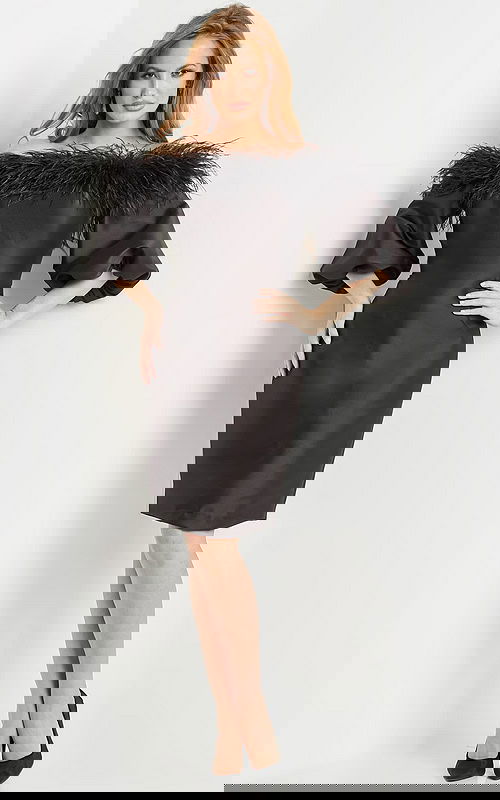 Model wearing Jovani 08211 black dress with off-the-shoulder neckline