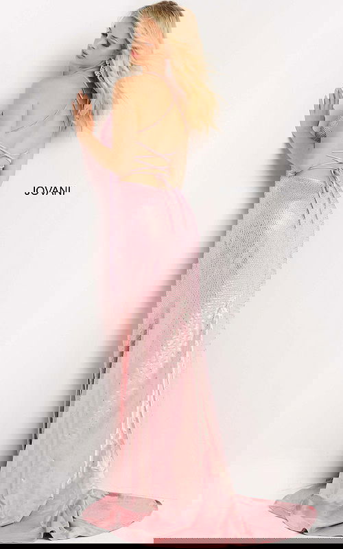 Model posing in Jovani 08400 blush dress with open back and lace-up detail