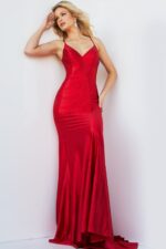Model showcasing Jovani 23010 red gown featuring lace-up back