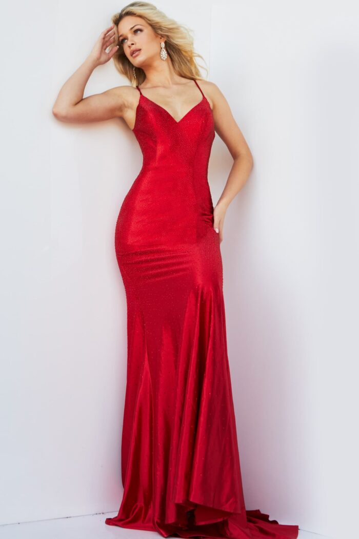 Model showcasing Jovani 23010 red gown featuring lace-up back