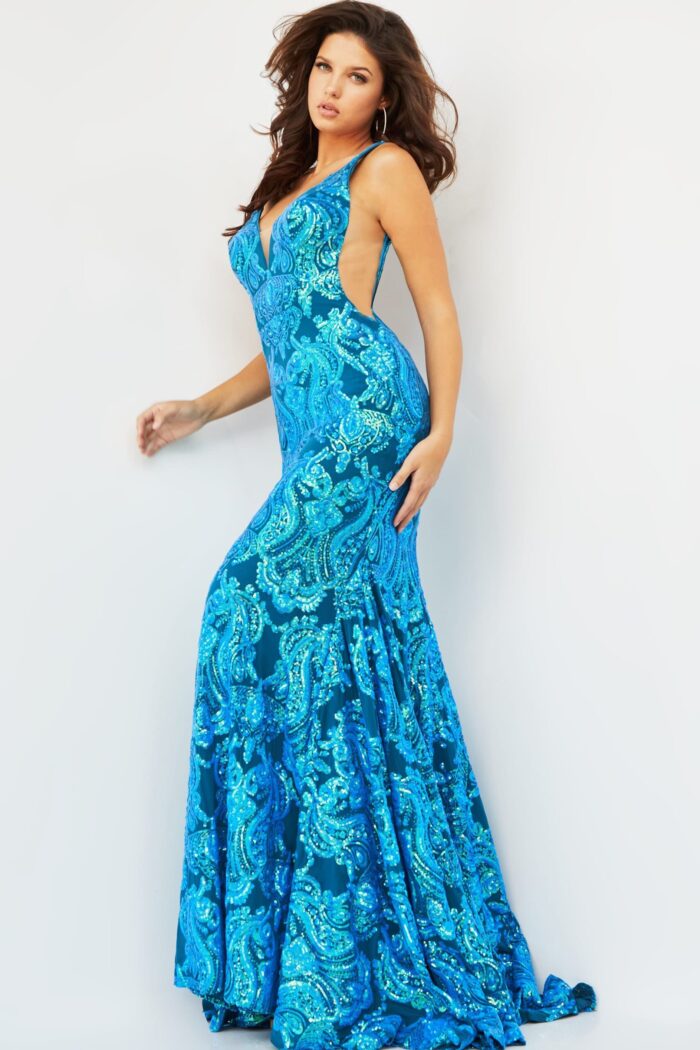 Model posing in Jovani 08646 Royal gown with a v-neckline and elegant mermaid silhouette.