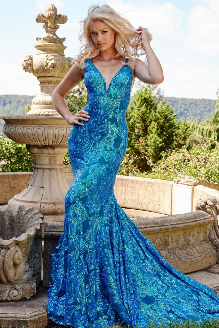 Model posing in Jovani 08646 Royal gown with shimmering sequin patterns.