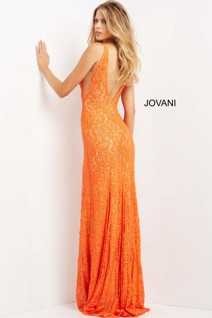 Back view of model wearing Jovani 08674 orange dress with elegant lace detailing.