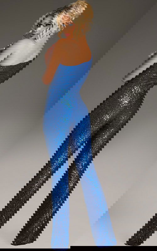 Back view of model wearing Jovani 09017 royal blue sequined jumpsuit.