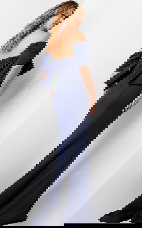 Back view of model wearing Jovani 09064 navy dress with bow accent.