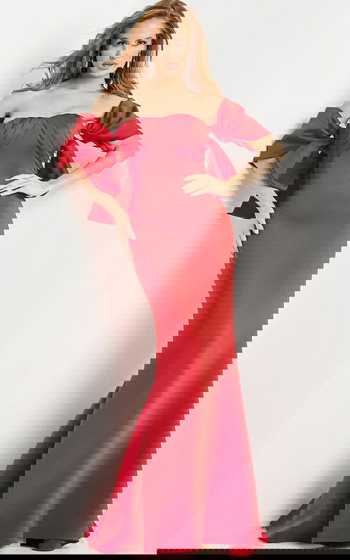 Model wearing Jovani 09064 red dress featuring off-the-shoulder neckline and pleated bodice.