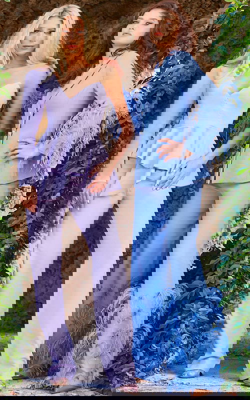 Two models in Jovani 09124 outfits, showcasing lilac jumpsuit and blue feathered suit