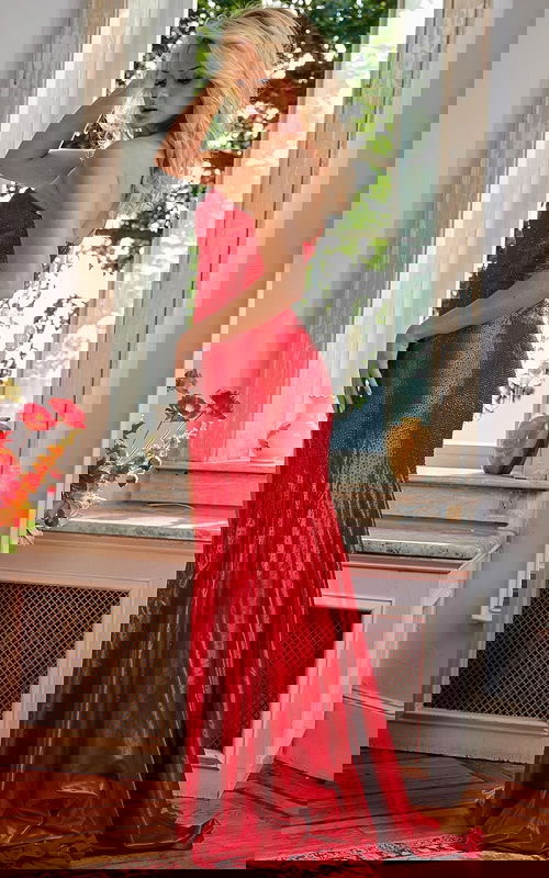 Back view of a model wearing Jovani 08157 red gown showing beadwork and silhouette.