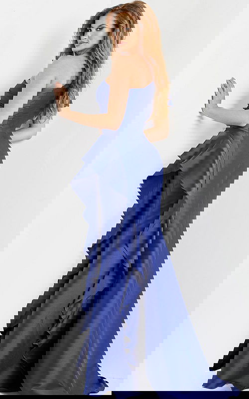 Back view of model wearing Jovani 09201 blue gown with ruffle design and one-shoulder puff sleeve.