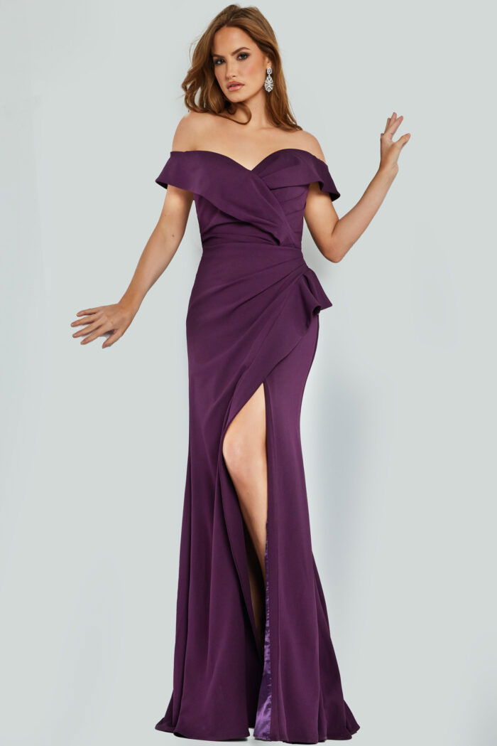 Model wearing 09436 plum gown with off-the-shoulder neckline and high slit.