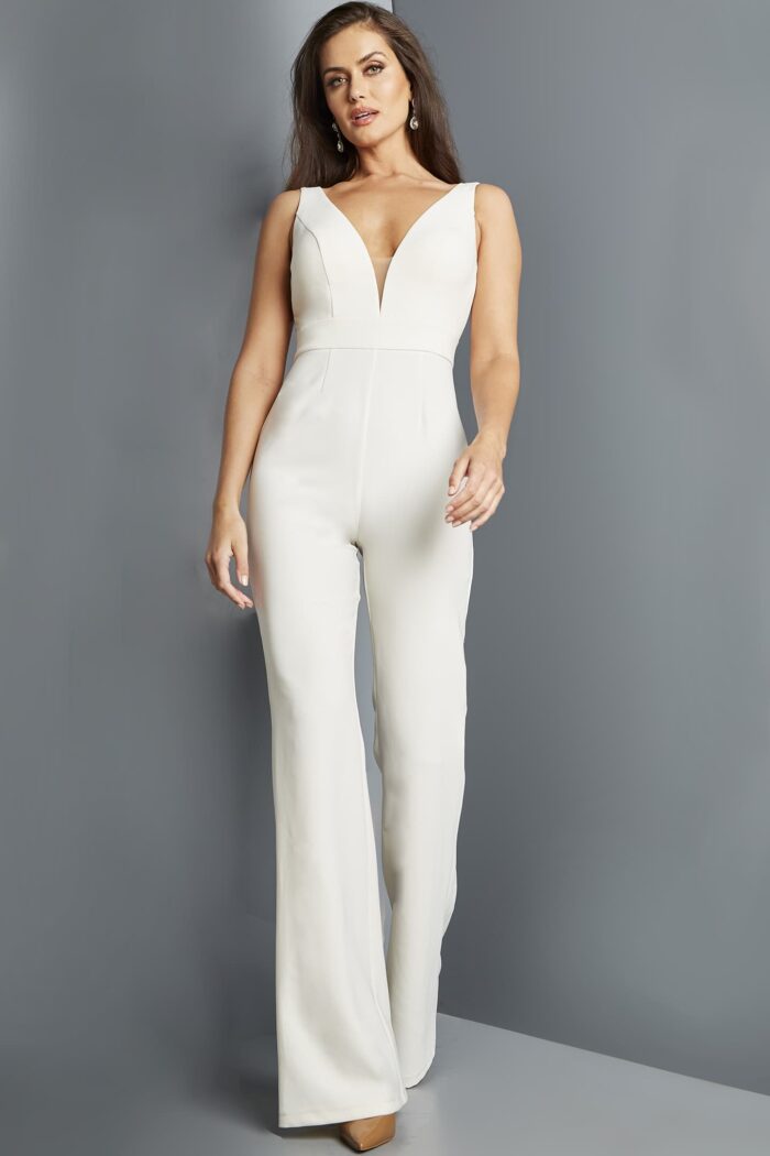 Model wearing Jovani 09479 ivory jumpsuit from the front with deep V-neckline