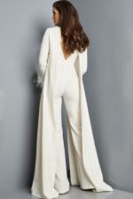 Model showcasing the back of Jovani 09479 ivory jumpsuit with open coat