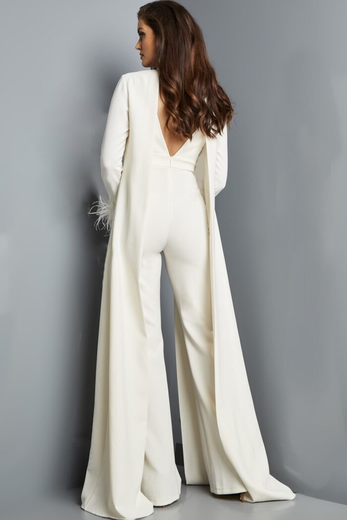 Model showcasing the back of Jovani 09479 ivory jumpsuit with open coat